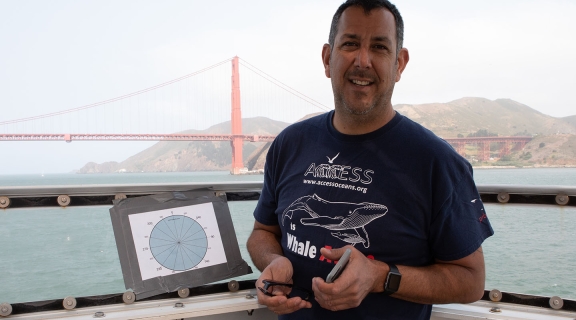 Jaime Jahncke on vessel with Golden Gate Bridge in background