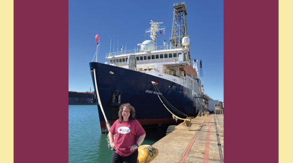 Laura Guertin in front of docked research vessel